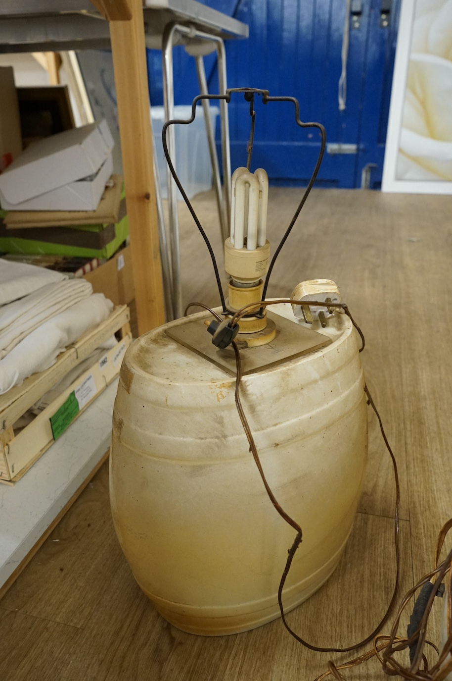 A pair of pottery Irish Whiskey and Rum spirit barrels, coaching scenes, converted to lamps, 56cm high overall